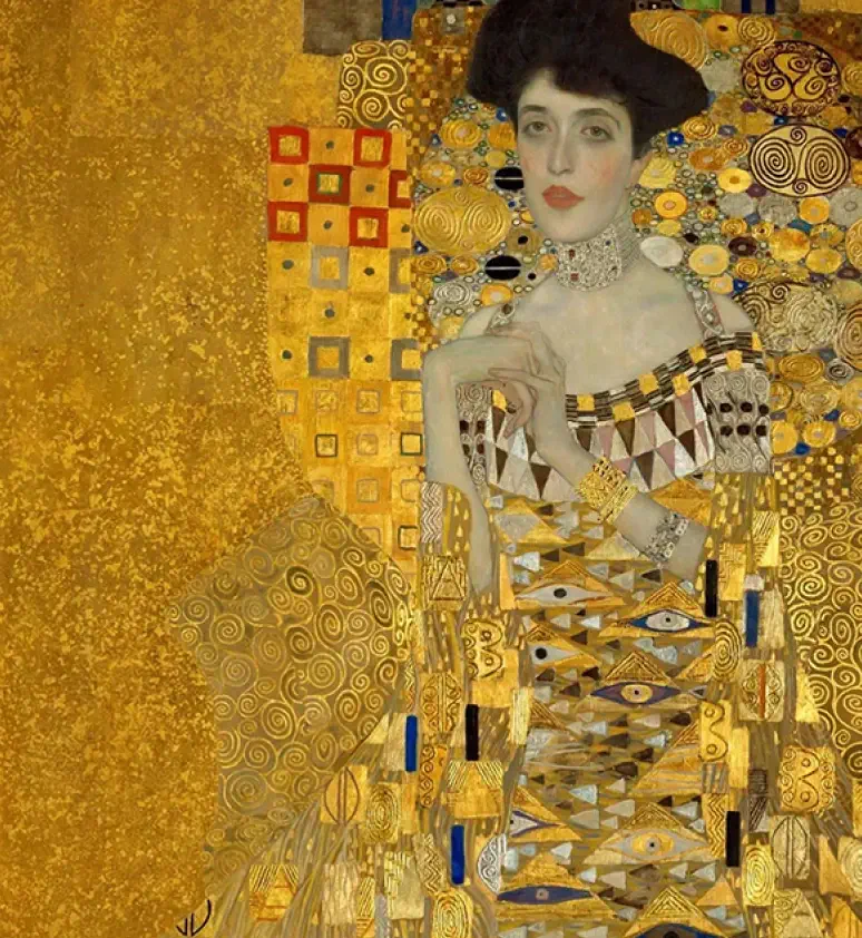 A woman in an ornate golden dress adorned with geometric patterns stands against a gold background in Gustav Klimt’s painting "Portrait of Adele Bloch-Bauer I.